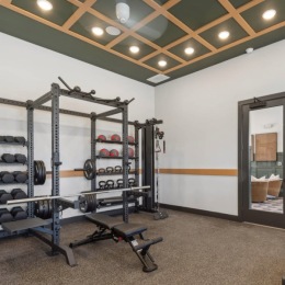 fitness center with open spaces and bright lighting through the windows