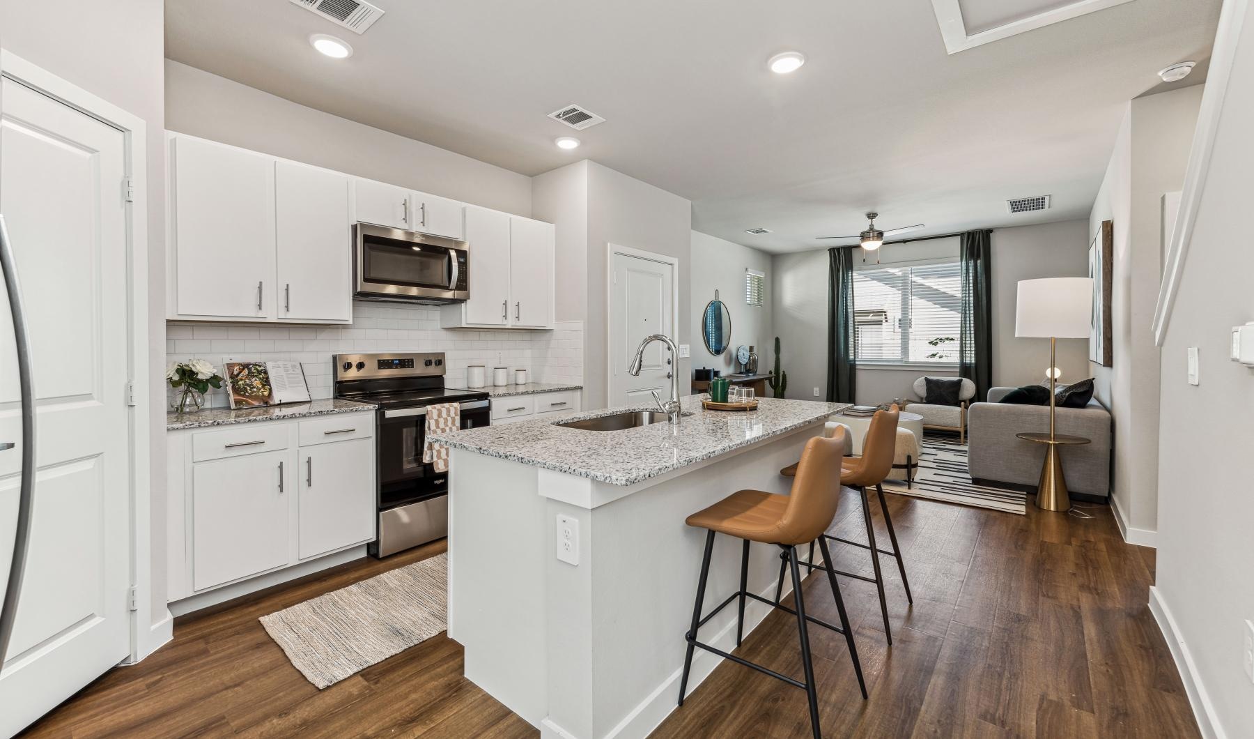 a kitchen with white cabinets
